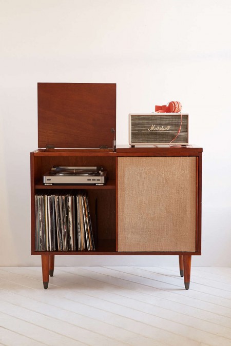 mid-century modern draper media console stores vinyl records, a turntable, and a marshall speaker
