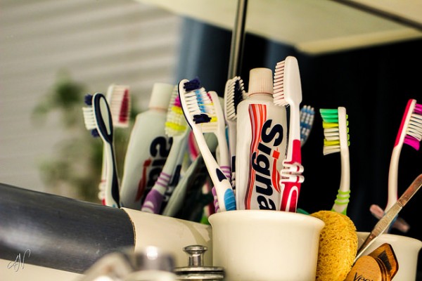 an organized toothbrush and toothpaste holder