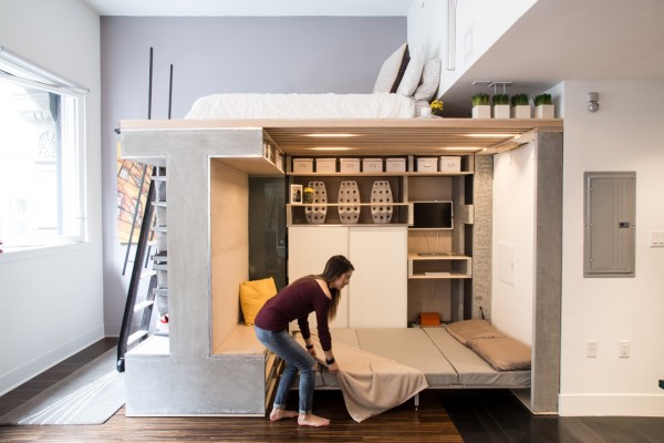 Nicki Wang tidies the Domino Loft system's Murphy bed.