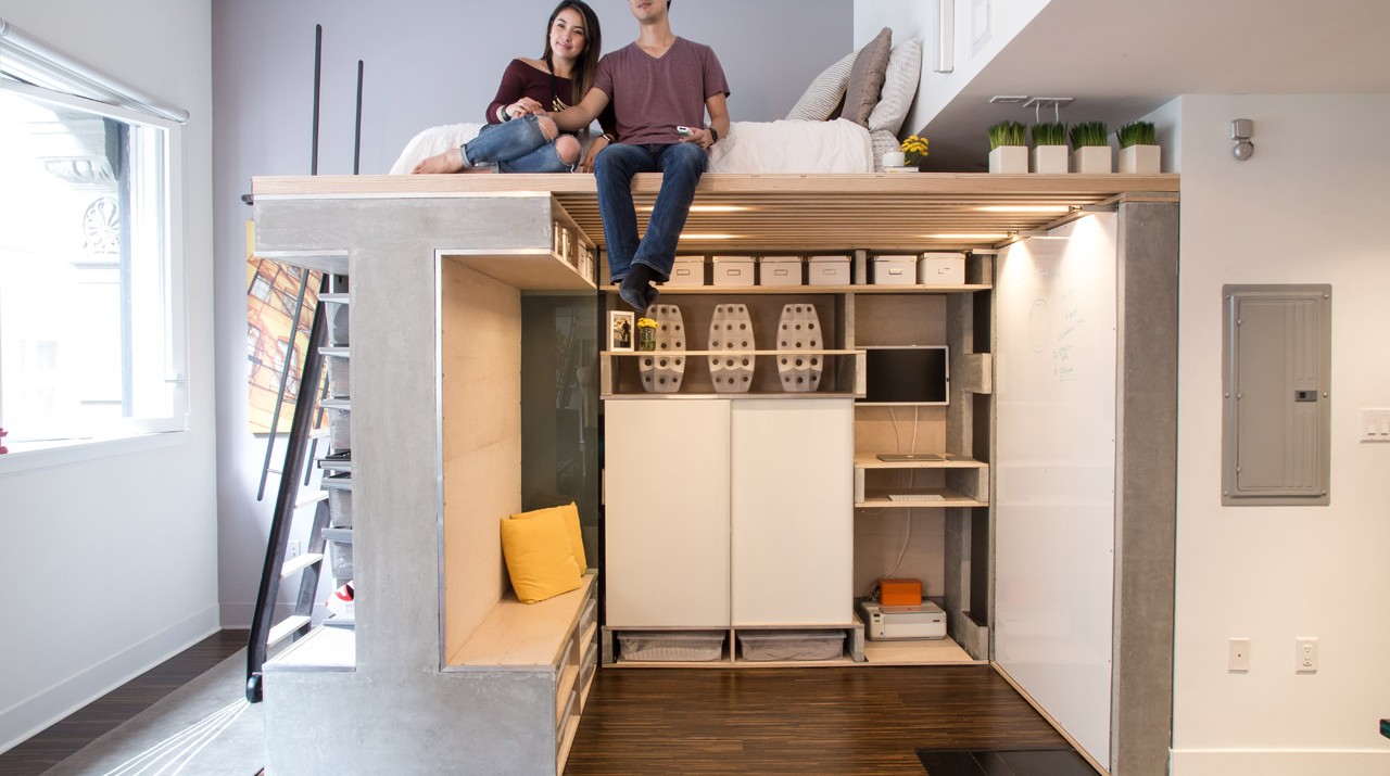 Treadfast owners Nicki and Donnie Wang sit on the Domino Loft system's bed in their 500-square-foot San Francisco apartment.