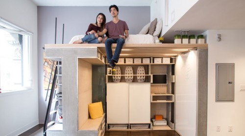 Treadfast owners Nicki and Donnie Wang sit on the Domino Loft system's bed in their 500-square-foot San Francisco apartment.