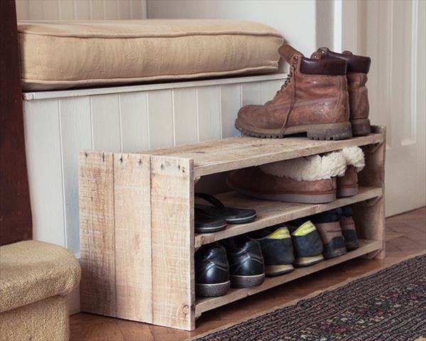 A small wood pallet shoe rack easily stores nine pairs of shoes, slippers, and boots.