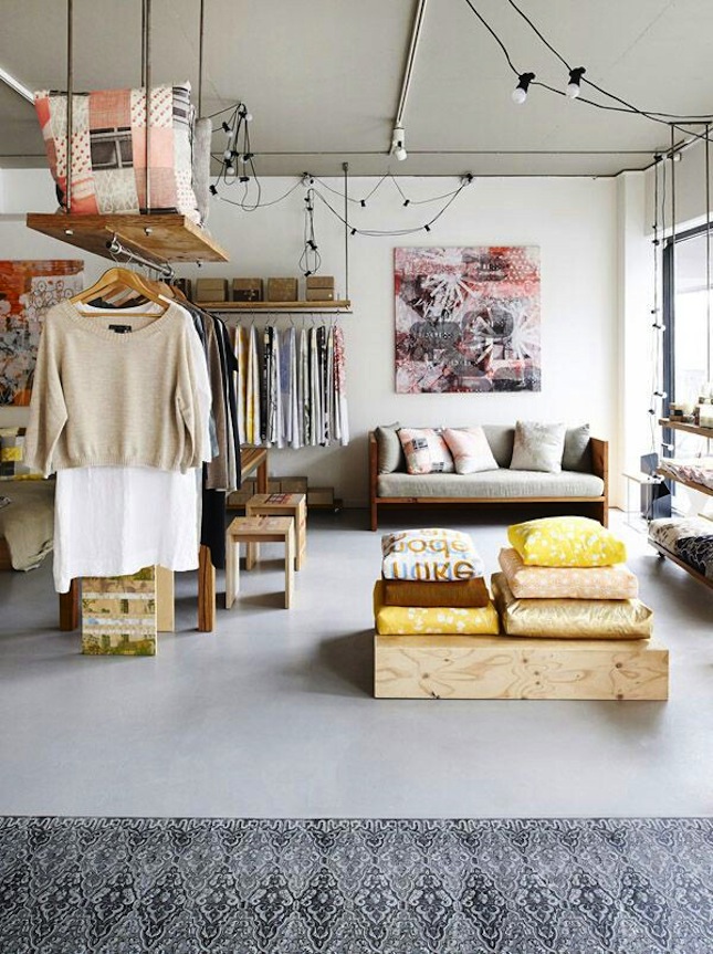 A floating closet helps to separate living areas in a studio apartment.