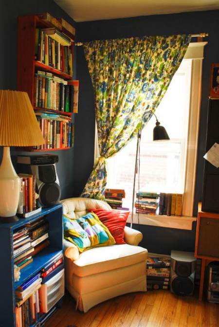 Move a chair in front of a window to create a cozy reading nook/personal space in your apartment.