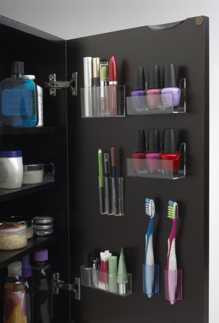 stickonpods medicine cabinet organizers storing makeup products, eye pencils, nail polish, tooth brushes, q-tips, a nail clipper, and more