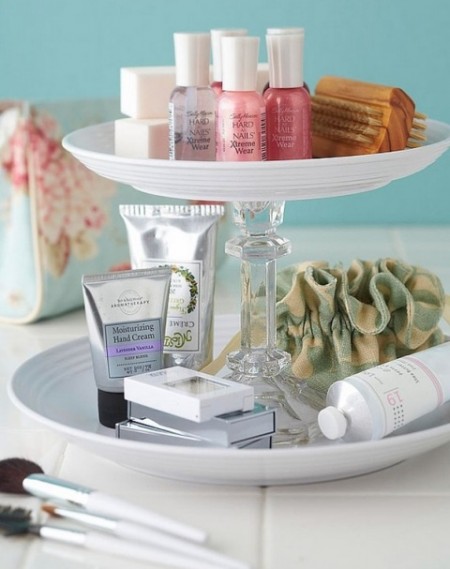 diy bathroom supply storage stand built from a candlestick and two plates