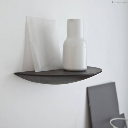 a gridy fungi floating shelf from lumens storing a white decorative vase