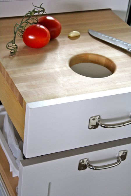 kitchen drawer hack: pull-out cutting board with a hole in the middle for throwing out scraps
