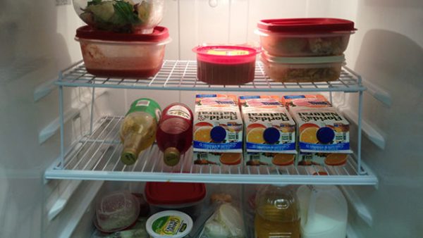 affordable fridge storage solution: put a wire rack on a shelf to create another shelf