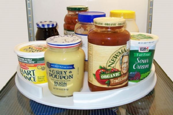 cheap fridge storage hack: use a lazy susan for storing condiments, jars, tubs, and more