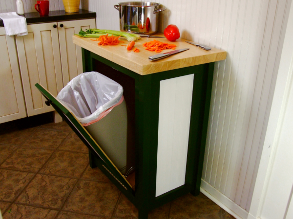 a butcher block/pull-out trash can is a creative diy kitchen storage idea