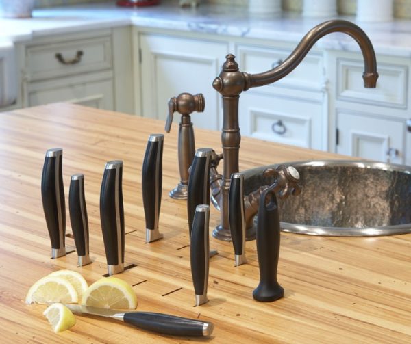 a kitchen counter that doubles as a knife holder is a smart storage hack for small spaces