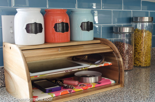 a diy breadbox charging station on a kitchen counter