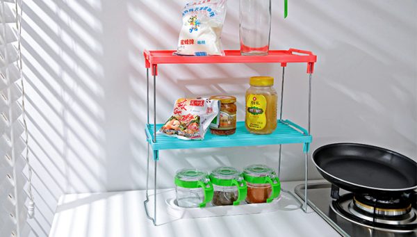 stacking small bathroom shelves on a kitchen counter is an easy storage tip