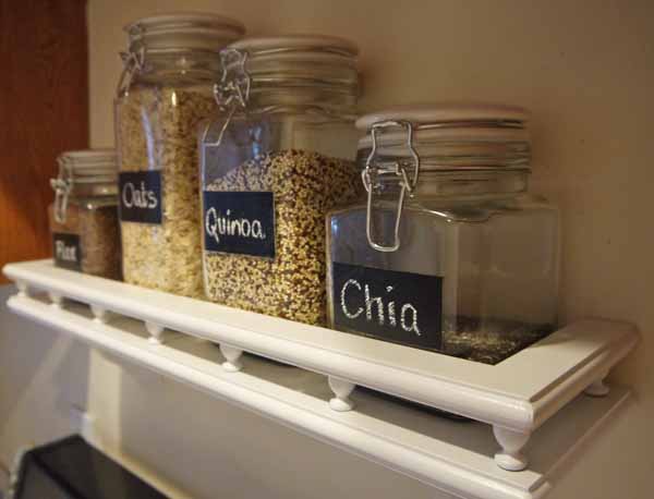 easy diy project: make a kitchen wall-mounted balcony for storing snacks, spices, and herbs in glass jars with chalkboards