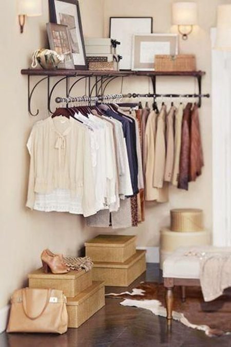 bedroom storage hack: install a clothes rack in an empty corner