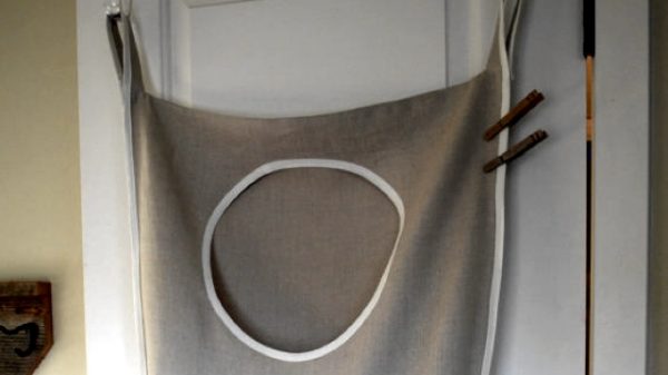Dirty clothes storage hack: hang a laundry hamper on the back of your bedroom door