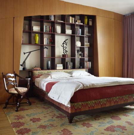 master bedroom headboard bookcase in an apartment at east lake shore drive in chicago, illinois