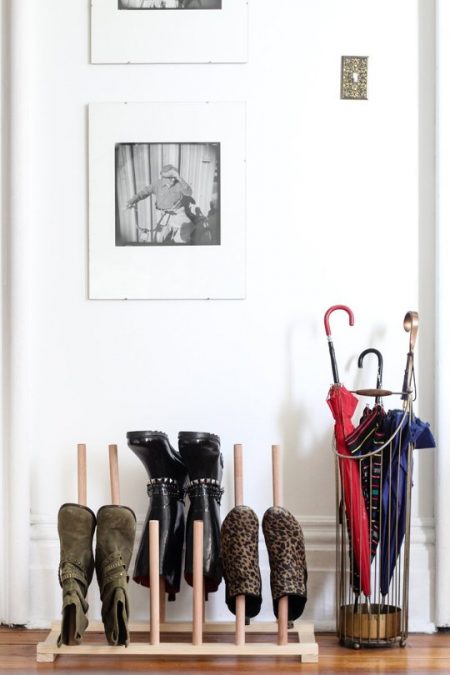 diy dowel shoe rack storing boots in an apartment