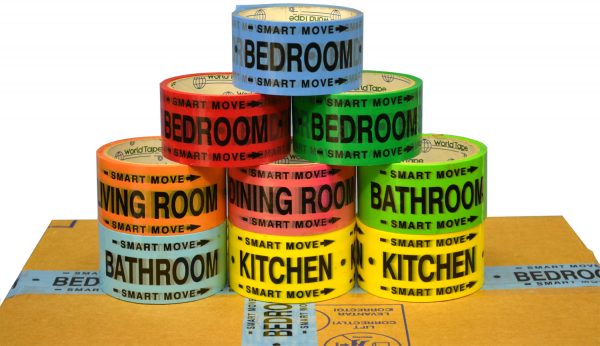 rolls of yellow, orange, red, pink, green, and blue color-coded moving tape with rooms printed on it are on top of a packed box