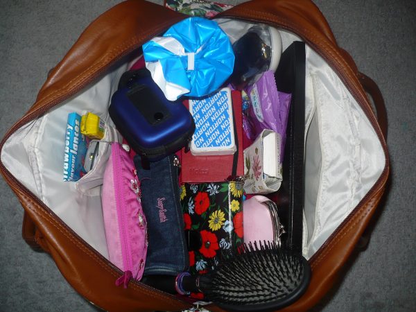 what to pack in overnight bag for moving: clothes, toiletries, water, laptop, snacks, gum 