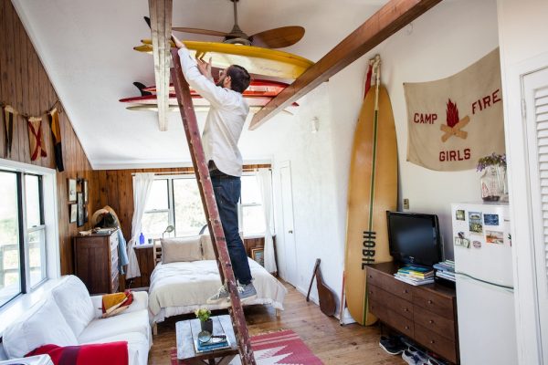 A rafters surfboard ceiling rack in a Montauk beach house