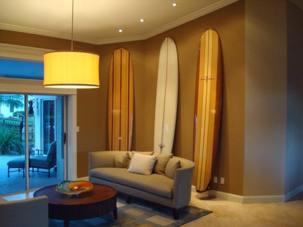 Wall surf racks for surfboard storage in a studio apartment
