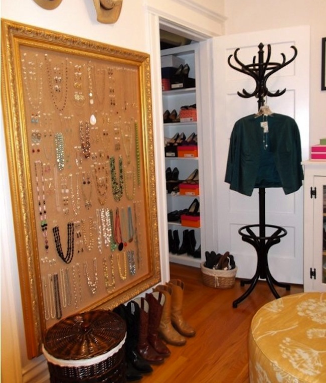 bedroom wall-mounted diy jewelry storage made from a cork board and an empty art frame