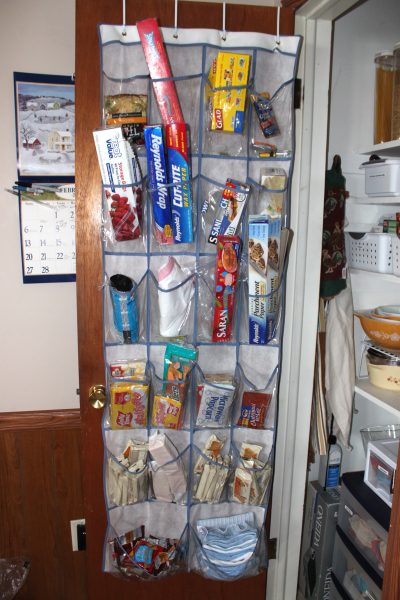 kitchen pantry shoe organizer hangs over the door