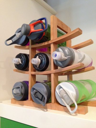 kitchen wine rack water bottle storage inside a cabinet