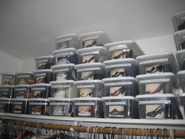 clear shoe boxes with lids, labels, and photos stored on a closet shelf