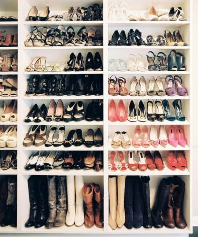 organized shoes and boots on shelves