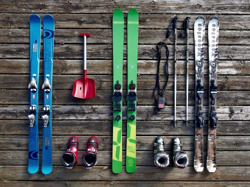 skis, ski boots, ski poles, and a shovel