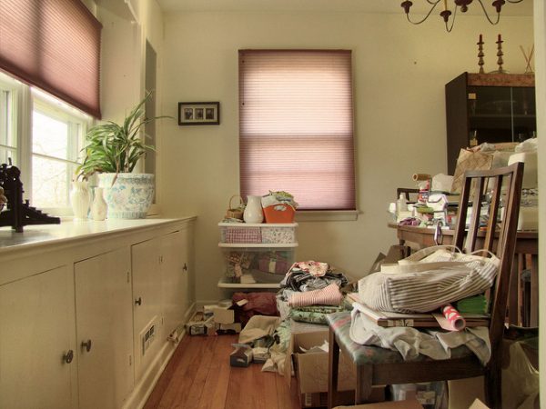 a cluttered dining room, the opposite of living a minimalist lifestyle