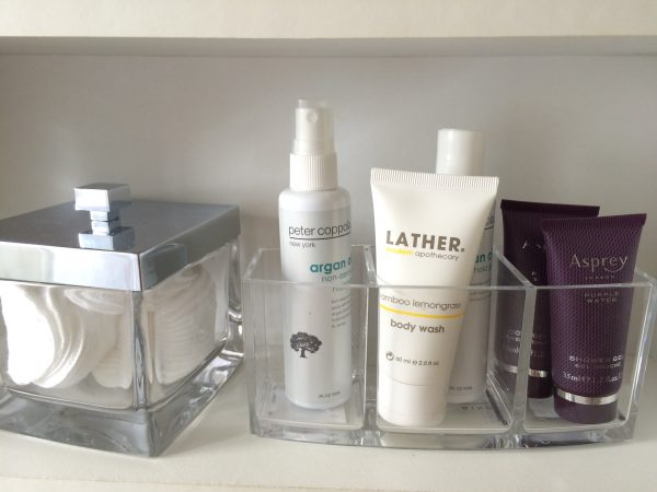 lucite desk organizer lotion holder on a shelf