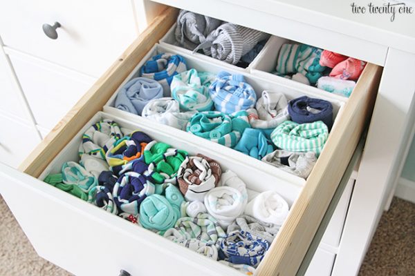 organized nursery dresser storing baby clothes