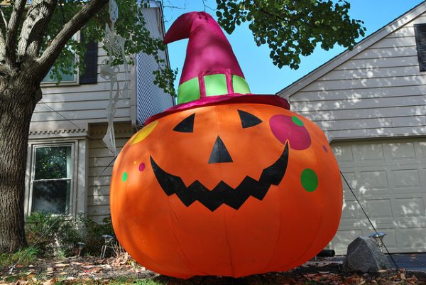 inflatable jack o lantern in a house's front yard