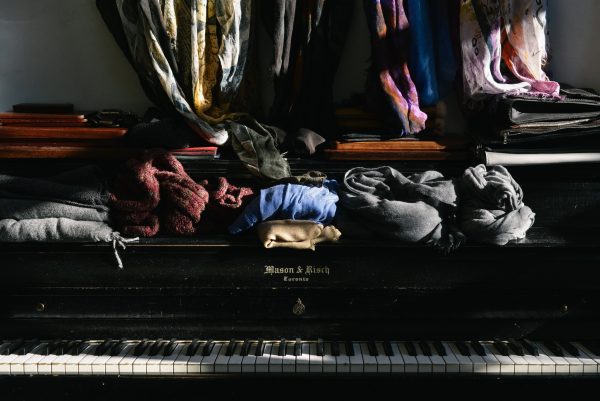 clothes on top of a mason risch piano