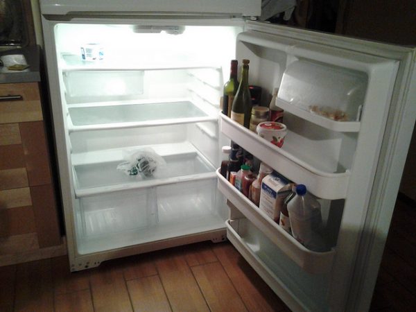 near empty fridge ready to defrost thanksgiving turkey