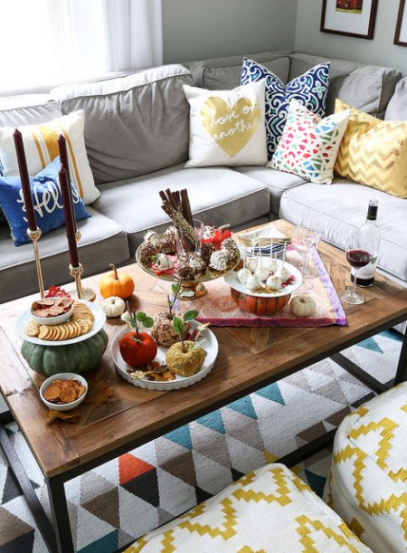 friendsgiving coffee table setting in an apartment living room