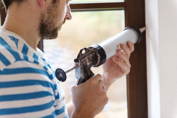 caulking windows to stop wind from coming through