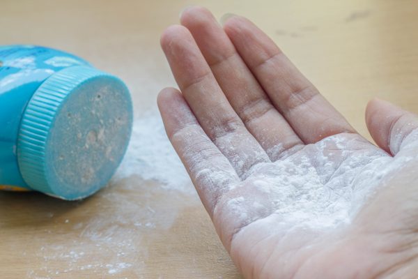 fix squeaky floors with baby powder