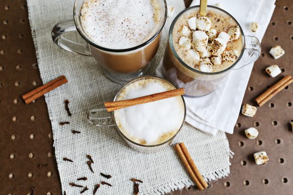 3 glasses of non-dairy latte, chai, and mocha with marshmallows and cinnamon sticks