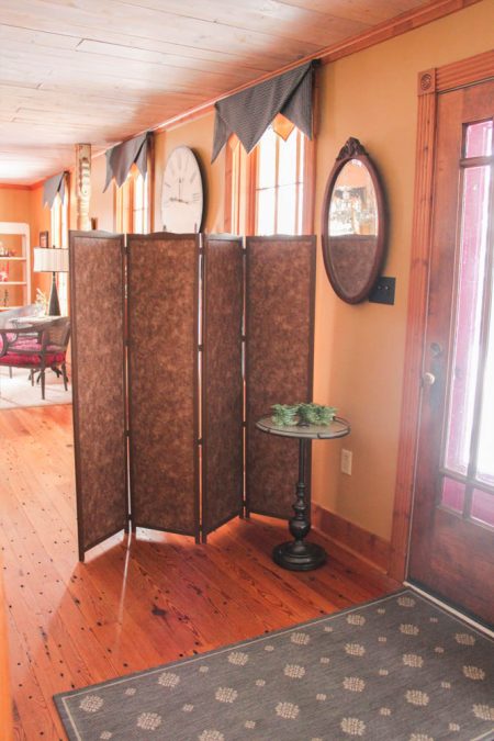 merri cvetan's entryway after building and adding a custom 4-panel room divider