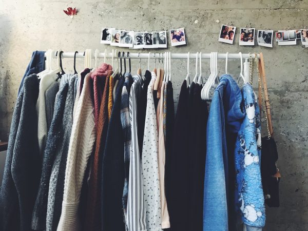 hygge clothing hanging on a clothes rack in an apartment