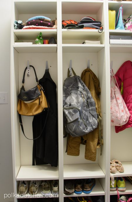 ikea mudroom lockers storing backpacks, bags, shoes, jackets, vests, notebooks, clothes, and other school accessories