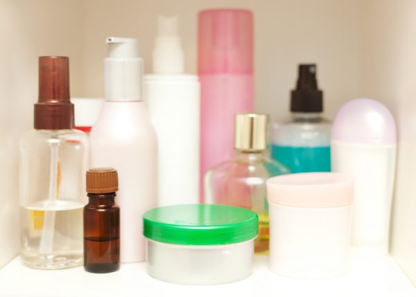 organized cosmetics and toiletries in a white bathroom cabinet