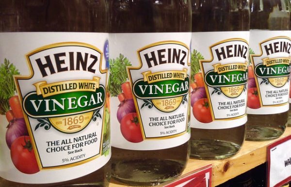 bottles of heinz distilled white vinegar on a store shelf