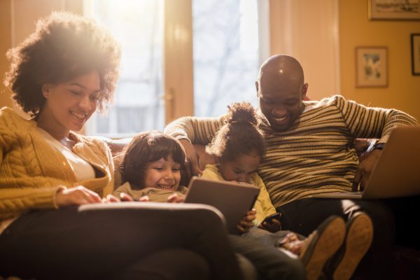 happy family spending time together on a couch