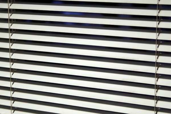 white window blinds facing downward